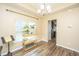 Living room featuring wood floors, modern lighting, and plant display looking to the kitchen at 5008 Bowles Dr, Summerville, SC 29485