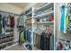 Spacious walk-in closet with custom shelving for shoes, folded clothes, hanging storage and hat storage at 5008 Bowles Dr, Summerville, SC 29485