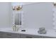 Elegant bathroom showcasing dual sinks, framed mirrors, and modern fixtures with a touch of gold at 5213 Seewee Rd, Awendaw, SC 29429