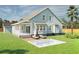 Back exterior of home with optional pool and patio space perfect for outdoor relaxation and entertainment at 5213 Seewee Rd, Awendaw, SC 29429