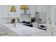 Modern kitchen with stainless steel appliances, a marble countertop, and gold accents at 5213 Seewee Rd, Awendaw, SC 29429