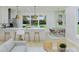 Open-concept kitchen flows into living and dining area, creating a bright and airy space at 5213 Seewee Rd, Awendaw, SC 29429