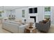 Cozy living room featuring a fireplace, comfortable seating, and natural light from large windows at 5213 Seewee Rd, Awendaw, SC 29429