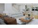 Bright and airy living room with open floor plan, flowing into the kitchen and dining area at 5213 Seewee Rd, Awendaw, SC 29429