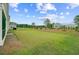 Expansive backyard with lush lawn, mature landscaping, and a charming pool house perfect for entertaining at 523 Fern Tree Dr, Summerville, SC 29486