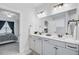 Bright bathroom features a double sink vanity with white cabinets and view to the main bedroom at 523 Fern Tree Dr, Summerville, SC 29486