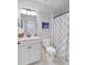 Bright bathroom featuring a modern vanity, toilet, and shower with stylish patterned curtain at 523 Fern Tree Dr, Summerville, SC 29486
