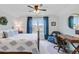 Charming bedroom with a decorative bed frame, ceiling fan, and a desk with chair at 523 Fern Tree Dr, Summerville, SC 29486