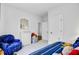 Bedroom showcasing a bed with navy striped bedding, decor, closet, and armchair at 523 Fern Tree Dr, Summerville, SC 29486