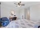 Serene bedroom featuring a full bed, accent chair, desk, and a ceiling fan for comfort at 523 Fern Tree Dr, Summerville, SC 29486