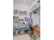 Organized closet with shelving, hanging clothes, and a built-in table at 523 Fern Tree Dr, Summerville, SC 29486