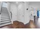 Open concept foyer features wood flooring, stairs, and entry to the kitchen at 523 Fern Tree Dr, Summerville, SC 29486