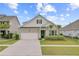 Charming home featuring a brick facade, attached garage, palm trees, and a well-manicured front yard at 523 Fern Tree Dr, Summerville, SC 29486