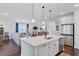 Bright open-concept kitchen featuring stainless steel appliances, kitchen island, and view of the living area at 523 Fern Tree Dr, Summerville, SC 29486