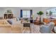 Cozy living room featuring hardwood flooring, a comfortable sectional sofa, and large windows for ample natural light at 523 Fern Tree Dr, Summerville, SC 29486