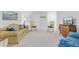Cozy living room with sofa, rocking chairs, dresser with television, and artwork at 523 Fern Tree Dr, Summerville, SC 29486