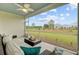 Relaxing screened patio with comfortable seating and a ceiling fan, offering serene outdoor views at 523 Fern Tree Dr, Summerville, SC 29486