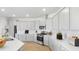 Spacious kitchen featuring white cabinets, quartz countertops, stainless steel appliances, and wood flooring at 540 Richfield Way, Summerville, SC 29486