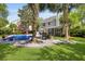 Private backyard with a pool, patio, and lush landscaping, perfect for relaxation and entertaining at 5401 Diston Court, North Charleston, SC 29420