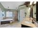 Elegant bathroom featuring a large soaking tub, glass shower, and double vanity at 5401 Diston Court, North Charleston, SC 29420