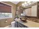 Stylish bathroom features a bowl sink, decorative mirror, and a tiled accent wall at 5401 Diston Court, North Charleston, SC 29420