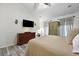 Comfortable bedroom with a large dresser, wood floors, and a ceiling fan at 5401 Diston Court, North Charleston, SC 29420