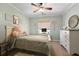 Cozy bedroom features soft colors, a comfortable bed, and a decorative dresser at 5401 Diston Court, North Charleston, SC 29420