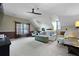 Spacious bonus room with vaulted ceilings, plush carpeting, and comfortable seating area at 5401 Diston Court, North Charleston, SC 29420