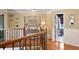 Hallway with wood flooring and natural light features views into the bathroom at 5401 Diston Court, North Charleston, SC 29420