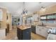 Bright kitchen features a stylish island, granite countertops, and stainless steel appliances at 5401 Diston Court, North Charleston, SC 29420