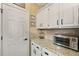 Granite countertops meet white cabinetry and modern stainless appliances in this updated kitchen at 5401 Diston Court, North Charleston, SC 29420