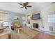 Comfortable living room featuring a fireplace, hardwood floors, a ceiling fan and a neutral color palette at 5401 Diston Court, North Charleston, SC 29420
