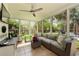 Bright sunroom features large windows, comfortable seating, and access to the backyard at 5401 Diston Court, North Charleston, SC 29420
