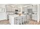 Modern kitchen featuring gray cabinets, stainless steel appliances, and an island with barstool seating at 549 Richfield Way Way, Summerville, SC 29486
