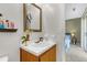 This bathroom features a well-lit vanity area and an open doorway with a view into the bedroom at 565 Travelers Blvd, Summerville, SC 29485