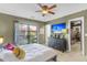 Cozy bedroom featuring a ceiling fan, TV, and a walk-in closet at 565 Travelers Blvd, Summerville, SC 29485