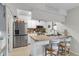 Well-lit kitchen featuring stainless steel appliances and a breakfast bar with seating at 565 Travelers Blvd, Summerville, SC 29485