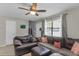 Comfortable living room featuring a leather sofa, wood floors, and a cozy atmosphere at 565 Travelers Blvd, Summerville, SC 29485