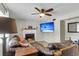 Spacious living room with a fireplace, modern ceiling fan, and a comfortable leather sofa at 565 Travelers Blvd, Summerville, SC 29485