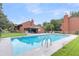 This community pool is surrounded by lush greenery, providing a relaxing escape for residents at 565 Travelers Blvd, Summerville, SC 29485