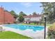 A community swimming pool offers a refreshing amenity amidst well-maintained grounds and residential buildings at 565 Travelers Blvd, Summerville, SC 29485