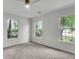 Light-filled empty bedroom featuring new windows, ceiling fan and modern decor at 5817 Canterbury Dr, Hanahan, SC 29410