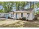 Charming single-story home with a welcoming front yard and inviting light blue front door at 5817 Canterbury Dr, Hanahan, SC 29410