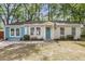 Cozy single-story home featuring light yellow and light blue siding, plus a well-manicured front yard at 5817 Canterbury Dr, Hanahan, SC 29410