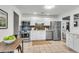 Modern kitchen with stainless steel appliances and white cabinetry complemented by wood accents at 5817 Canterbury Dr, Hanahan, SC 29410