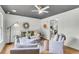 Sun-filled living room showing hardwood floors, a decorative mirror, and white walls at 5817 Canterbury Dr, Hanahan, SC 29410