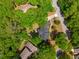 A bird's-eye view showcases a home surrounded by vibrant trees in a peaceful neighborhood setting at 667 Shortwood St, Charleston, SC 29412