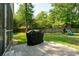 Lush backyard with mature trees and a playset offers ample space for outdoor activities at 667 Shortwood St, Charleston, SC 29412