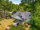 A serene screened porch provides an area to sit and enjoy the outdoors, a nice backyard and mature landscaping at 667 Shortwood St, Charleston, SC 29412