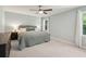Serene bedroom with neutral tones, a plush bed, and ample natural light from the windows at 667 Shortwood St, Charleston, SC 29412